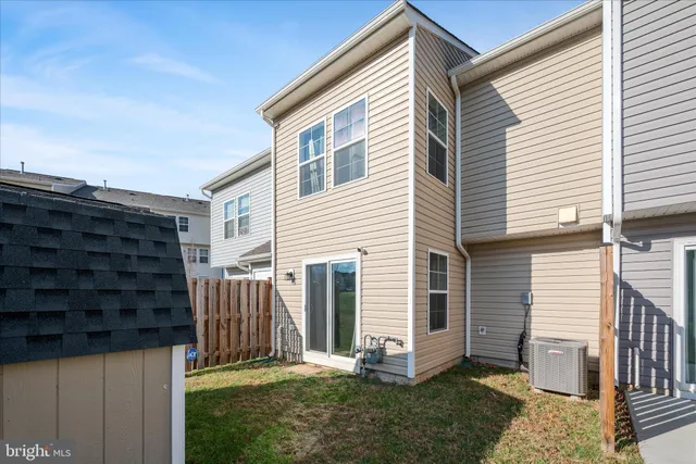 a view of backyard with tub and stairs