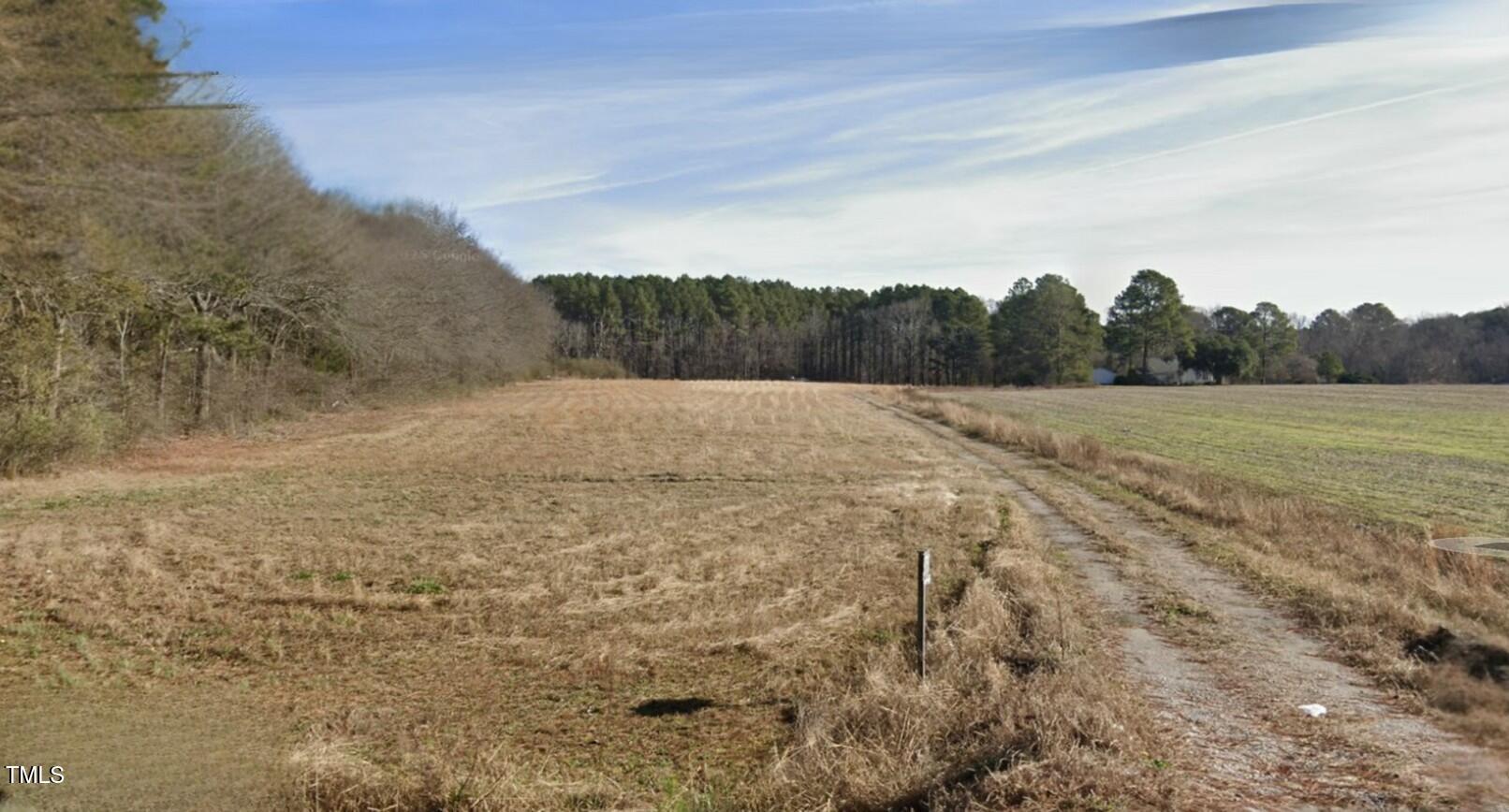 5745 Radford Road Lucama, NC 27851 - Photo 3 of 4 a view of an outdoor space and a yard