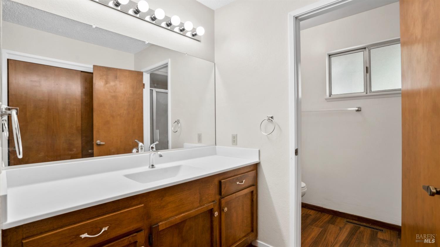 5210-5214 Fulton Road Santa Rosa, CA 95403 - Photo 20 of 60 a bathroom with a sink and a mirror