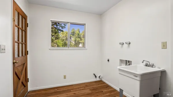 a house that has a tree in front of it