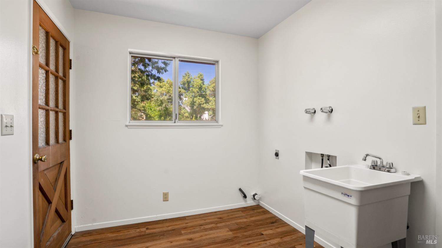 5210-5214 Fulton Road Santa Rosa, CA 95403 - Photo 25 of 60 a view of a bathroom with a sink and a mirror