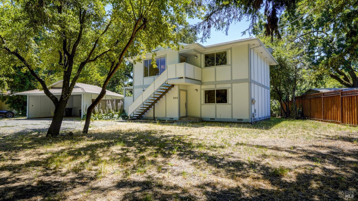 5210-5214 Fulton Road Santa Rosa, CA 95403 - Photo 28 of 60 a house that has a tree in front of it