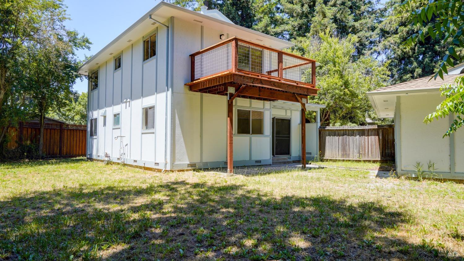 5210-5214 Fulton Road Santa Rosa, CA 95403 - Photo 31 of 60 a view of a house with backyard and tree