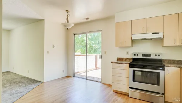 a view of balcony with wooden floor