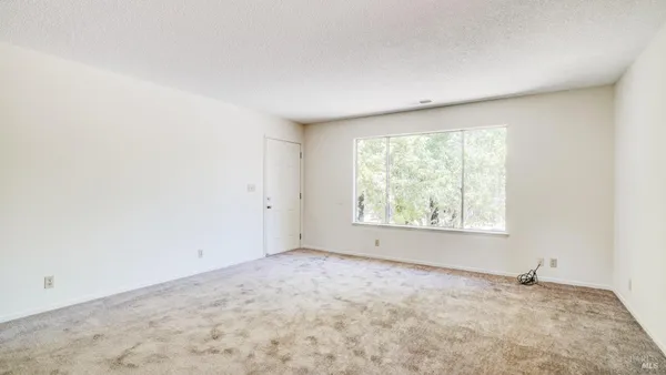 an empty room with a natural light