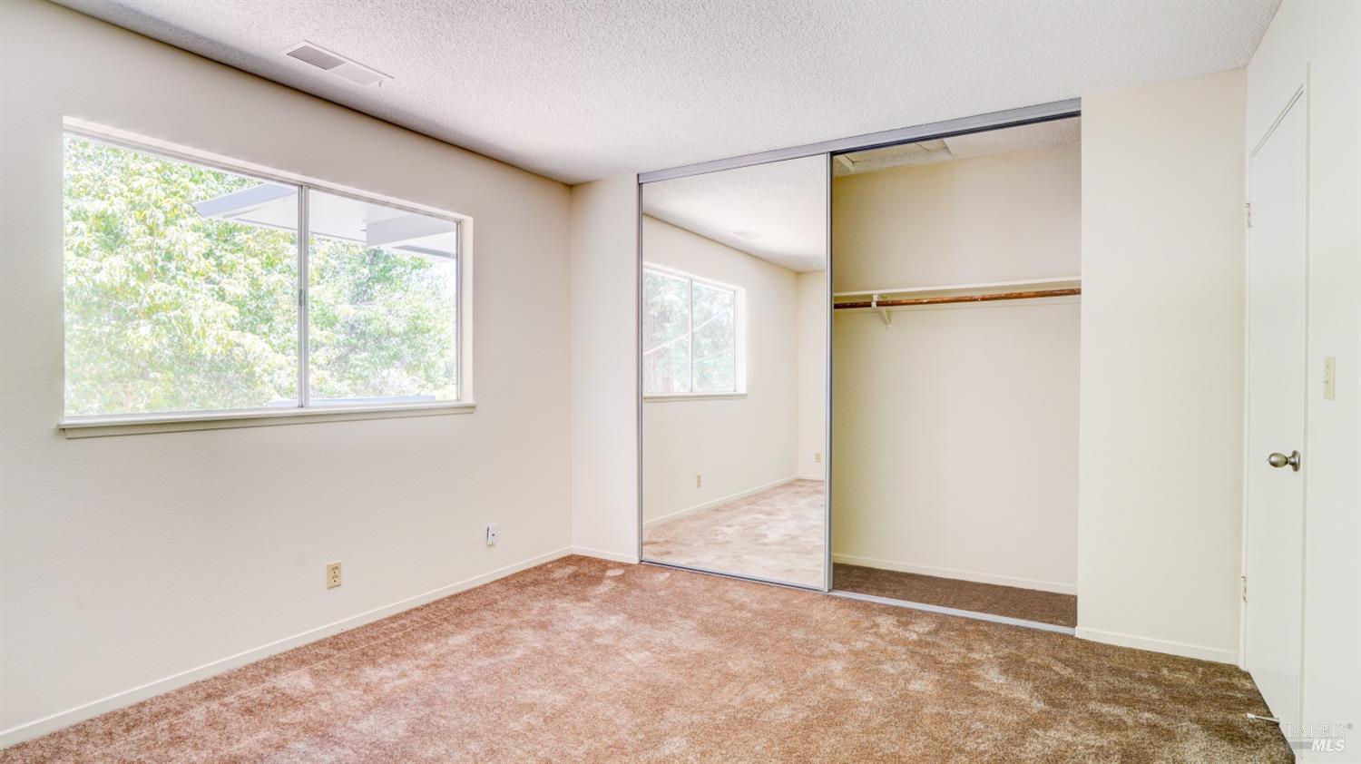 5210-5214 Fulton Road Santa Rosa, CA 95403 - Photo 41 of 60 an empty room with windows and closet