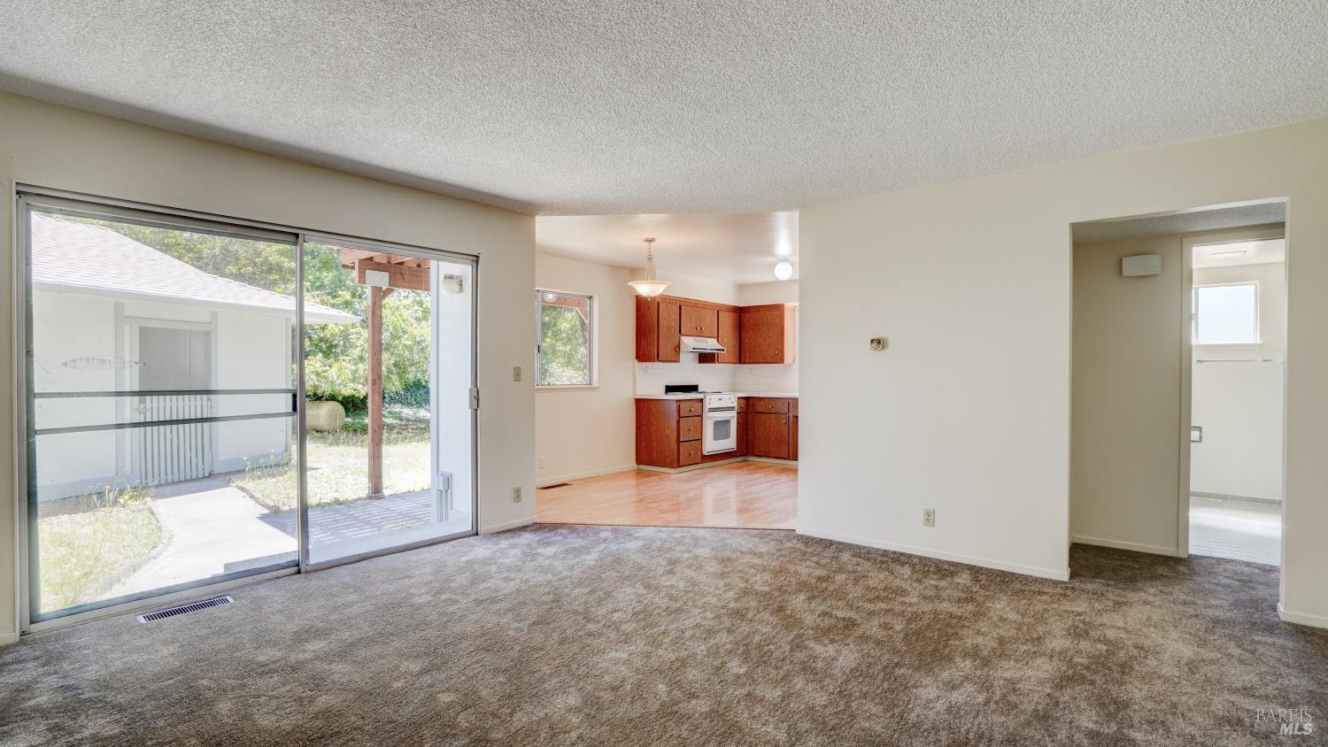 5210-5214 Fulton Road Santa Rosa, CA 95403 - Photo 42 of 60 Lower unit Living room with access to carport