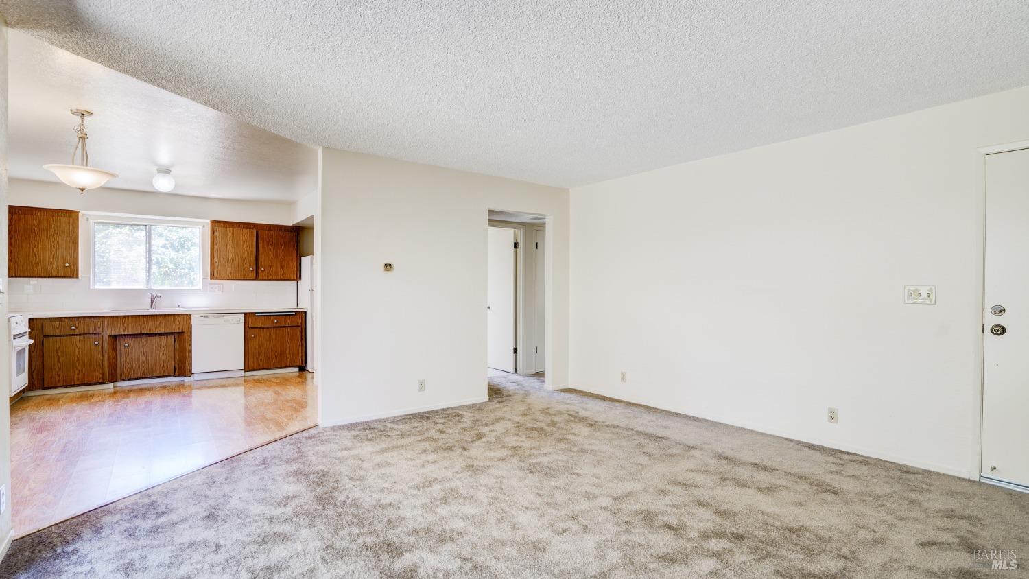 5210-5214 Fulton Road Santa Rosa, CA 95403 - Photo 46 of 60 a view of an empty room with a kitchen