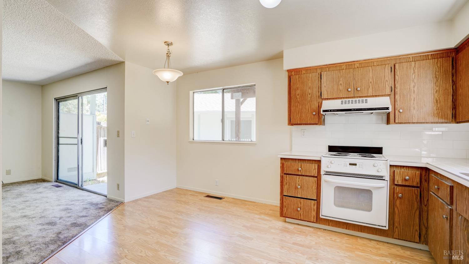 5210-5214 Fulton Road Santa Rosa, CA 95403 - Photo 47 of 60 a kitchen with a stove oven and a refrigerator