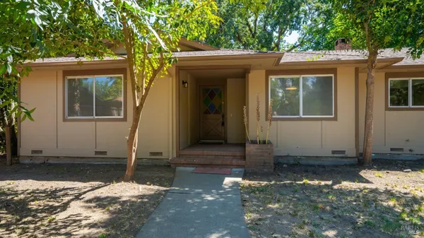wooden floor in an empty room with a fireplace