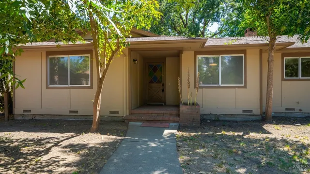 wooden floor in an empty room with a fireplace