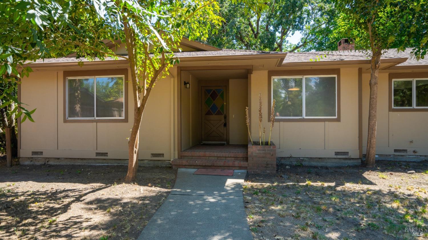5210-5214 Fulton Road Santa Rosa, CA 95403 - Photo 5 of 60 front view of a house with a yard