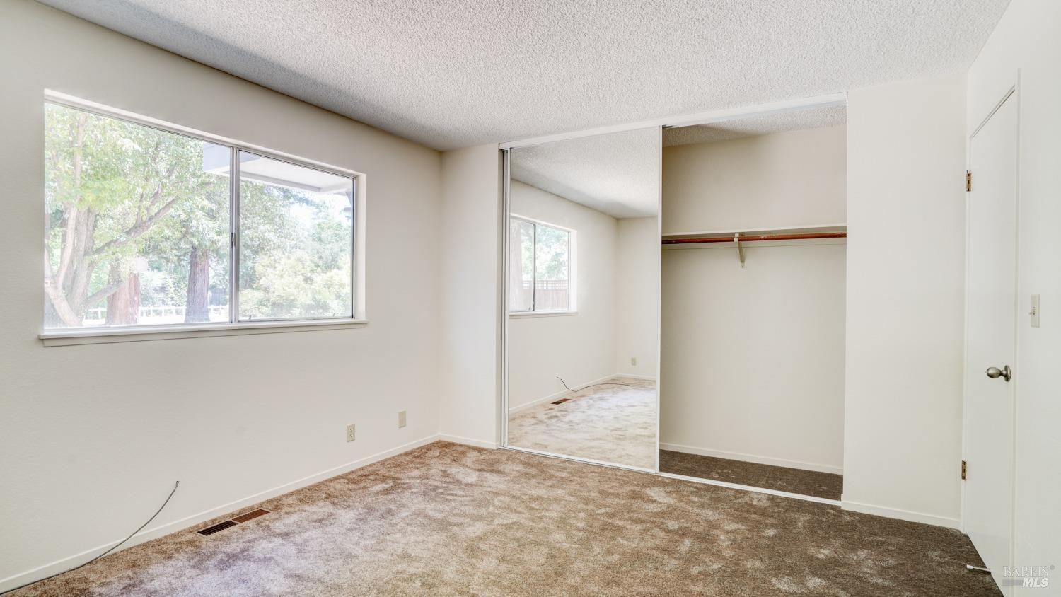 5210-5214 Fulton Road Santa Rosa, CA 95403 - Photo 51 of 60 an empty room with windows and closet