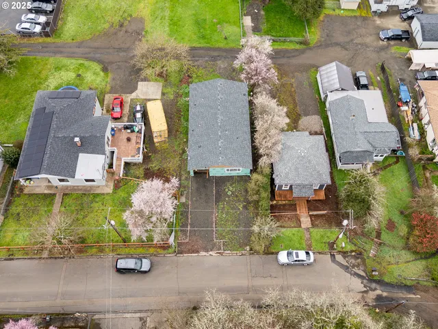 an aerial view of a house with outdoor space