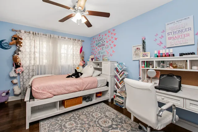 a bedroom with bed and a window