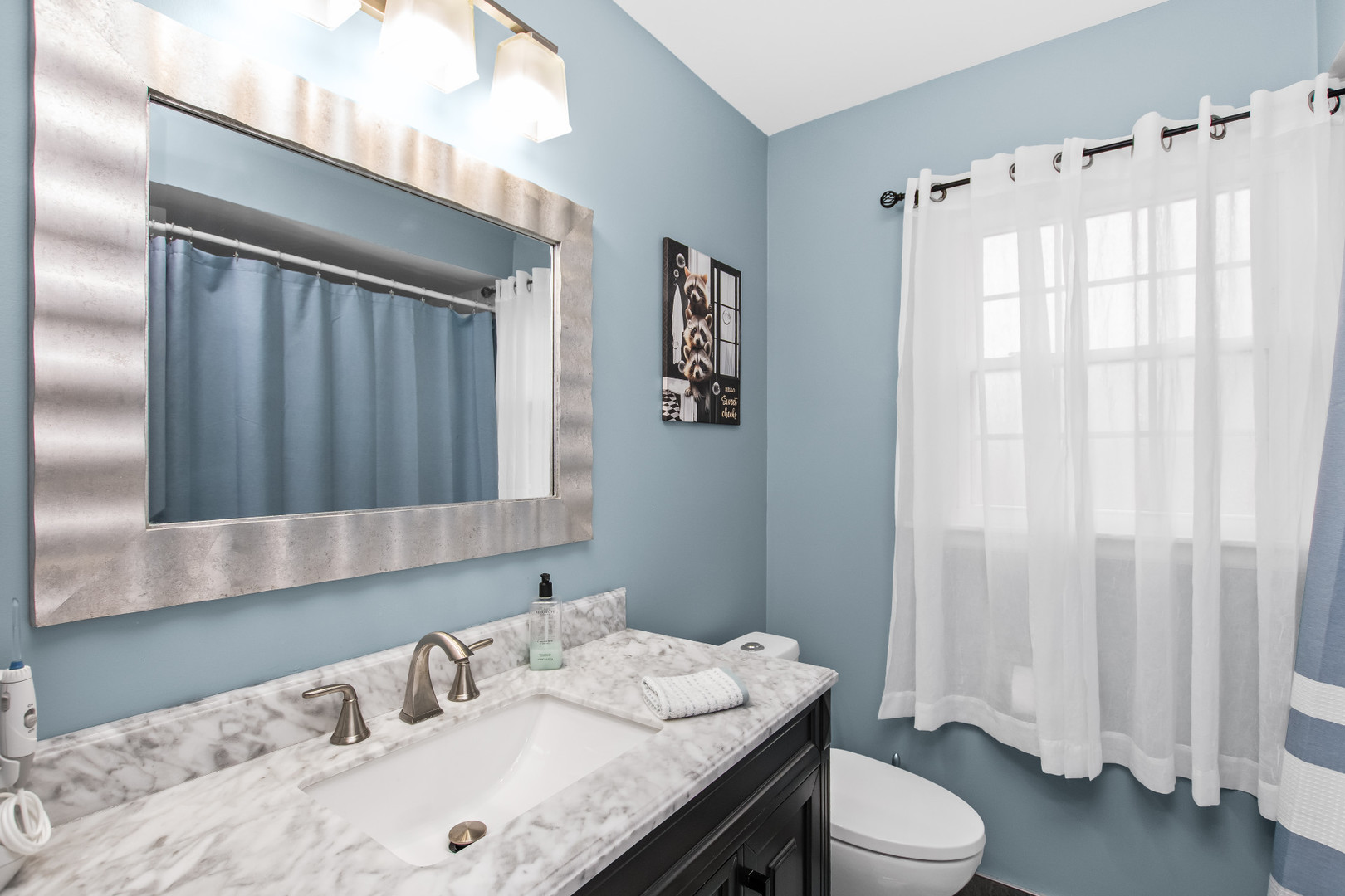 715 South Naperville Road Wheaton, IL 60189 - Photo 22 of 34 a bathroom with a granite countertop sink and a mirror
