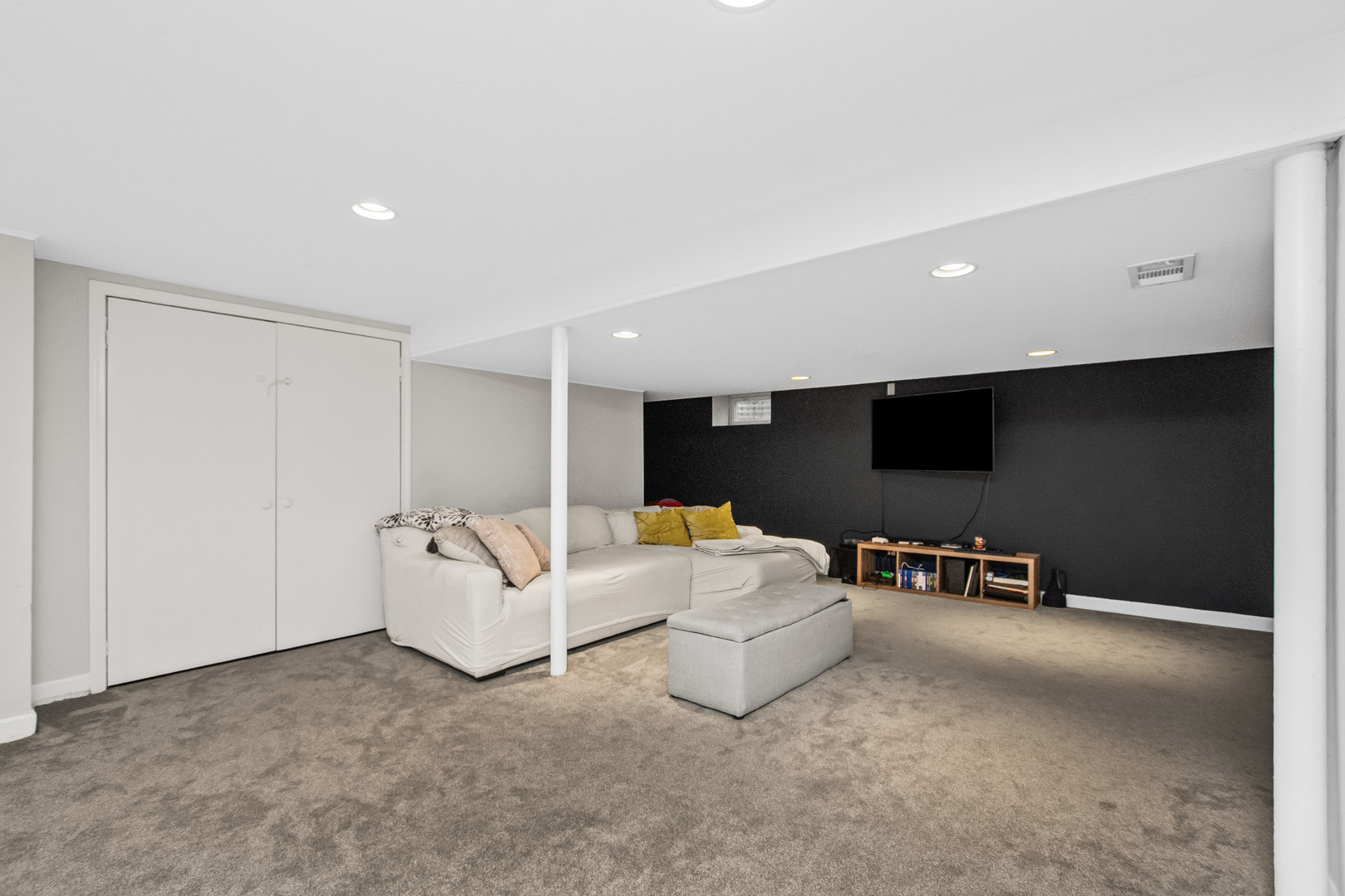 715 South Naperville Road Wheaton, IL 60189 - Photo 27 of 34 a living room with furniture and a flat screen tv