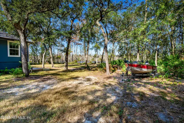 a front view of a house with a yard table and chairs