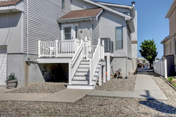 a view of a house with wooden floor and fence