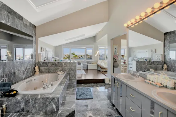 a room with furniture and floor to ceiling windows