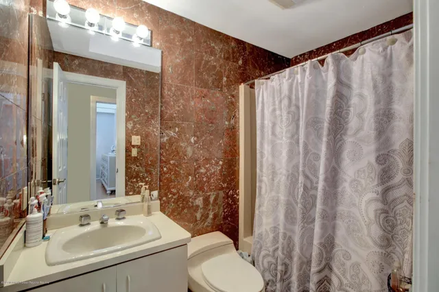 an outdoor sitting area with furniture and stove