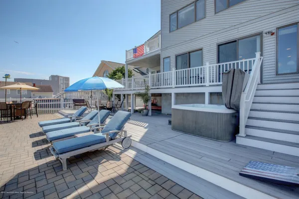 a view of a balcony with furniture