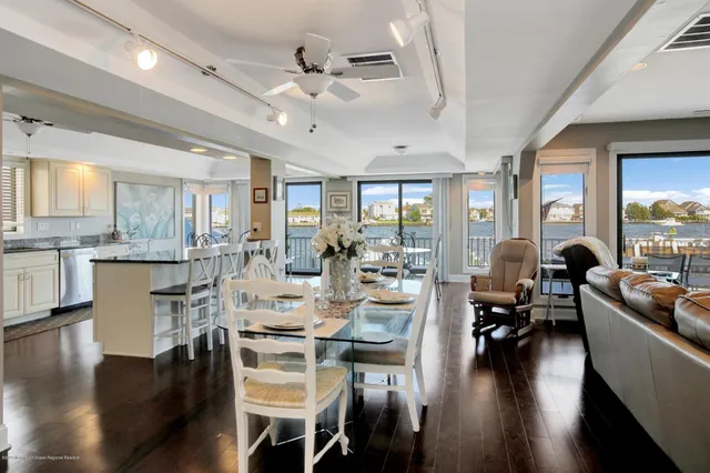 a view of house with outdoor seating space and wooden floor