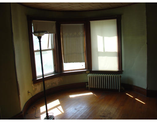 167 Allen Street Springfield, MA 01108 - Photo 8 of 22 a view of an empty room with a window