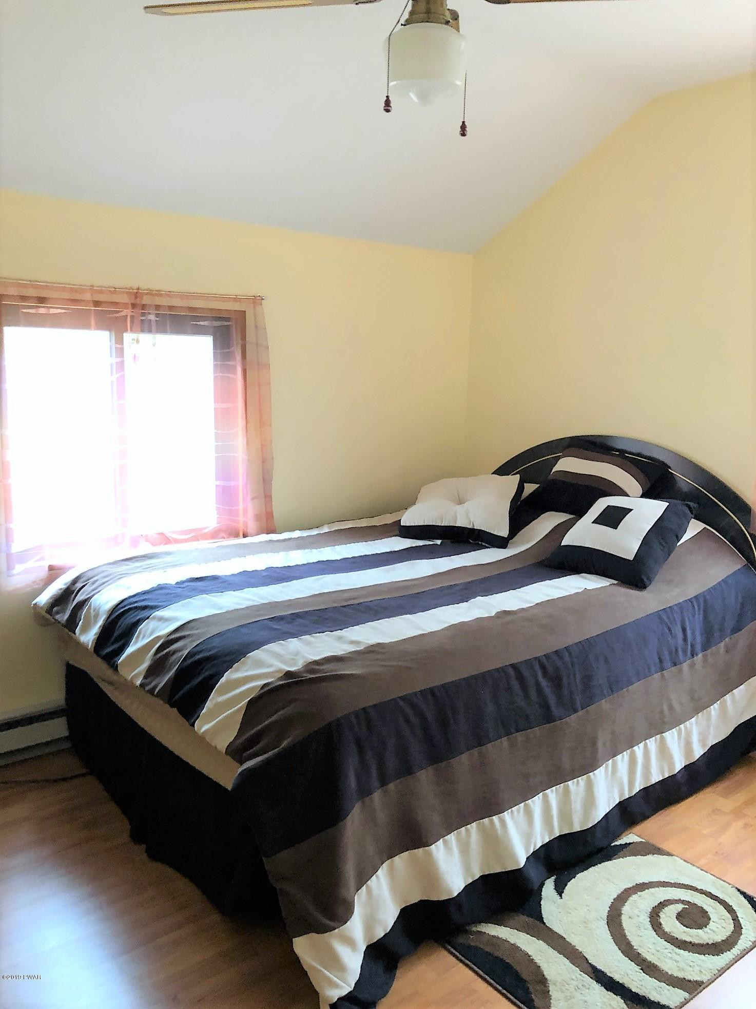 3039 Northgate Road Lake Ariel, PA 18436 - Photo 31 of 57 a bedroom with a bed and a window