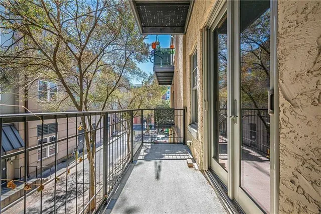 a view of a balcony with a potted plant