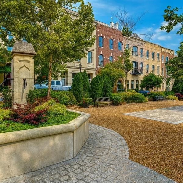 925 Garrett Street, Unit 215 Atlanta, GA 30316 - Photo 21 of 23 a front view of a house with a yard and potted plants