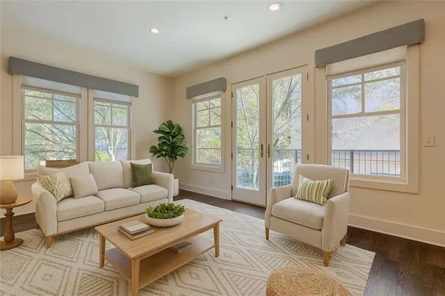 a living room with furniture and a large window