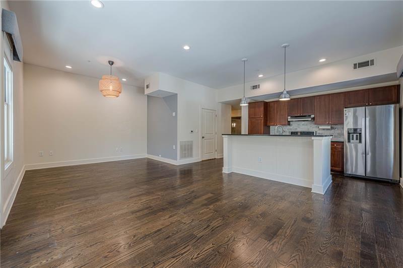 925 Garrett Street, Unit 215 Atlanta, GA 30316 - Photo 9 of 23 a view of kitchen with wooden floor and window