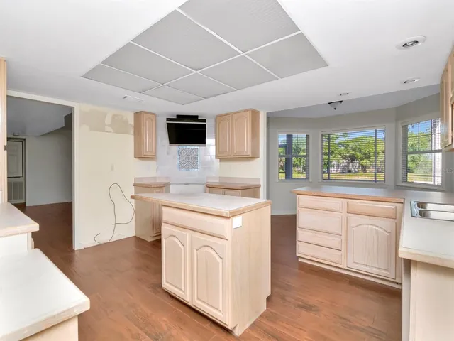 a kitchen with a stove a sink and a refrigerator