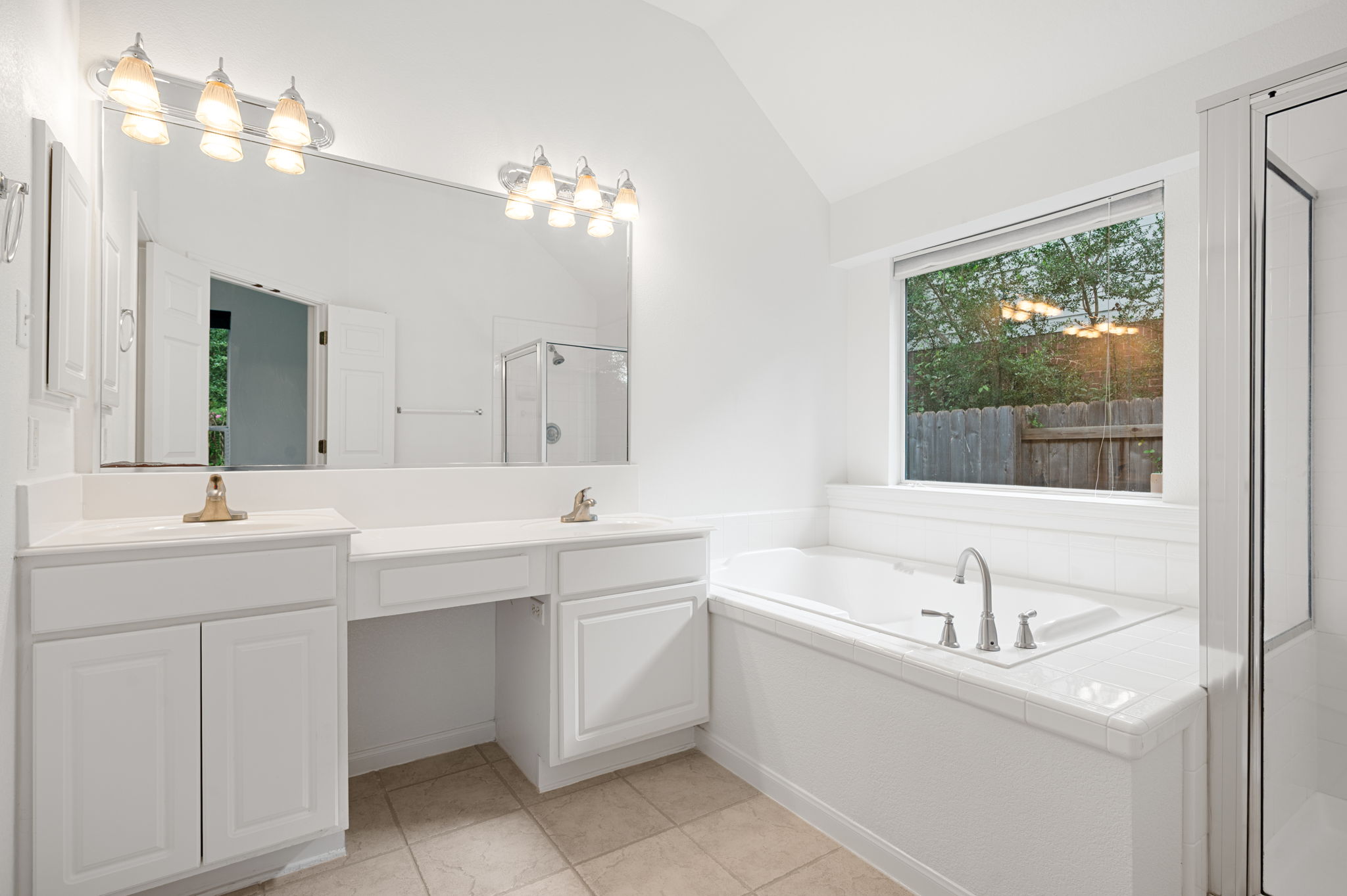 9201 La Siesta Bend Austin, TX 78749 - Photo 23 of 37 a bathroom with a sink tub double vanity and a mirror