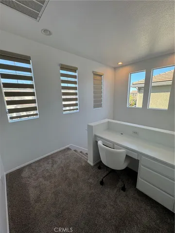 a bathroom with a bathtub and a window