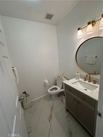 a bathroom with a double vanity sink and mirror