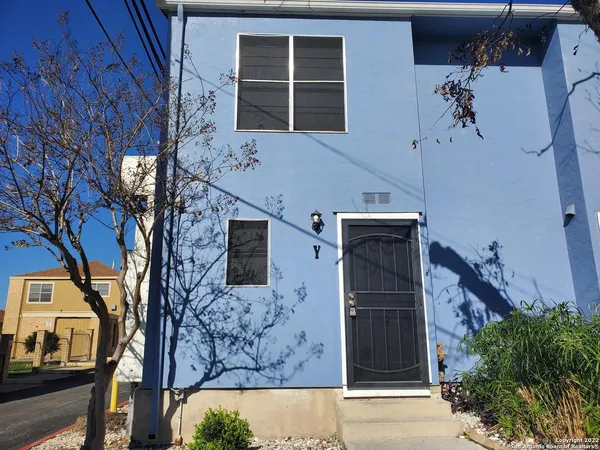 a front view of a house with parking space