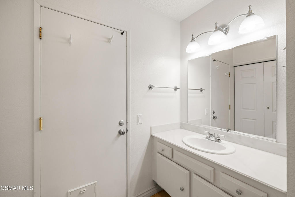 2044 Covington Avenue Simi Valley, CA 93065 - Photo 20 of 32 a bathroom with a sink and mirror