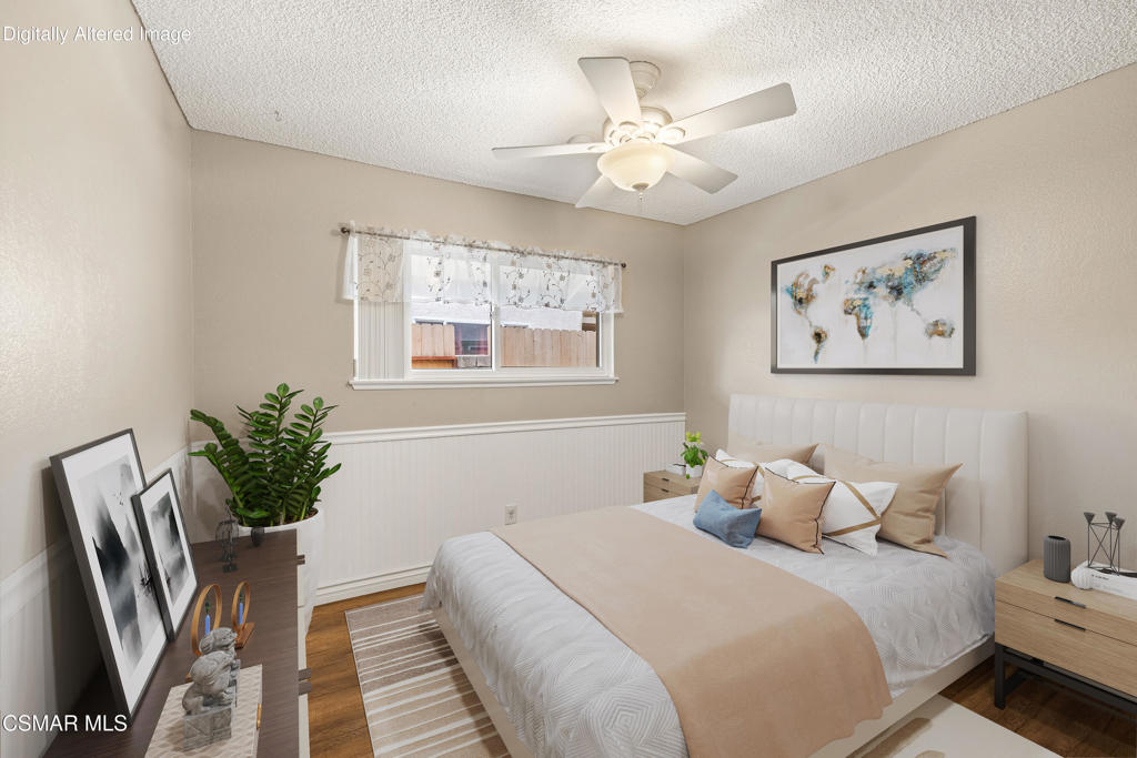 2044 Covington Avenue Simi Valley, CA 93065 - Photo 6 of 32 a bedroom with a large bed and a chandelier