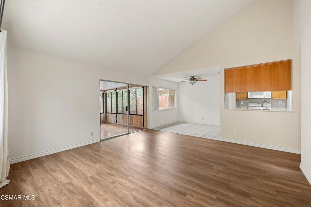 2044 Covington Avenue Simi Valley, CA 93065 - Photo 7 of 32 an empty room with wooden floor and windows