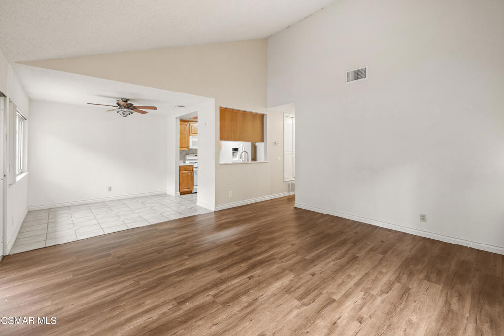 2044 Covington Avenue Simi Valley, CA 93065 - Photo 9 of 32 an empty room with wooden floor and windows