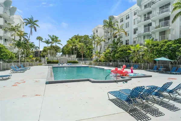 a view of a swimming pool with a lounge chairs