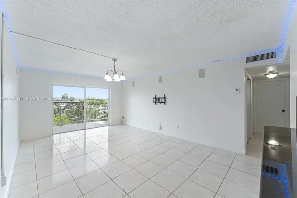 an empty room with windows and outdoor view