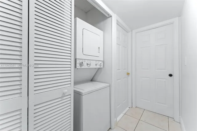 a view of bathroom with a washer and dryer