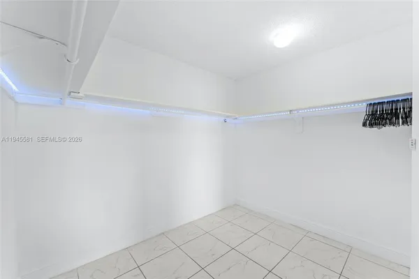 a view of an empty walk in closet