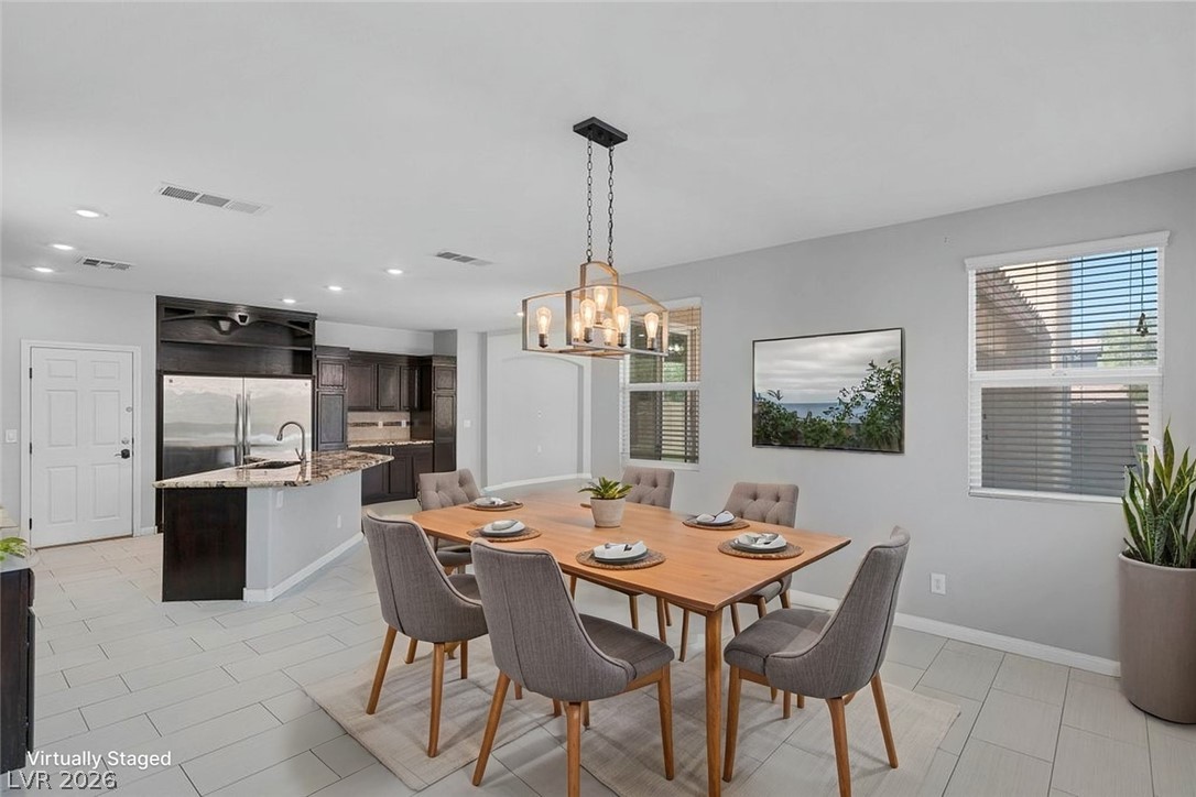 10336 Hawk Ravine Street Las Vegas, NV 89178 - Photo 13 of 59 Virtually Staged! Open and Bright Formal Entertaining!