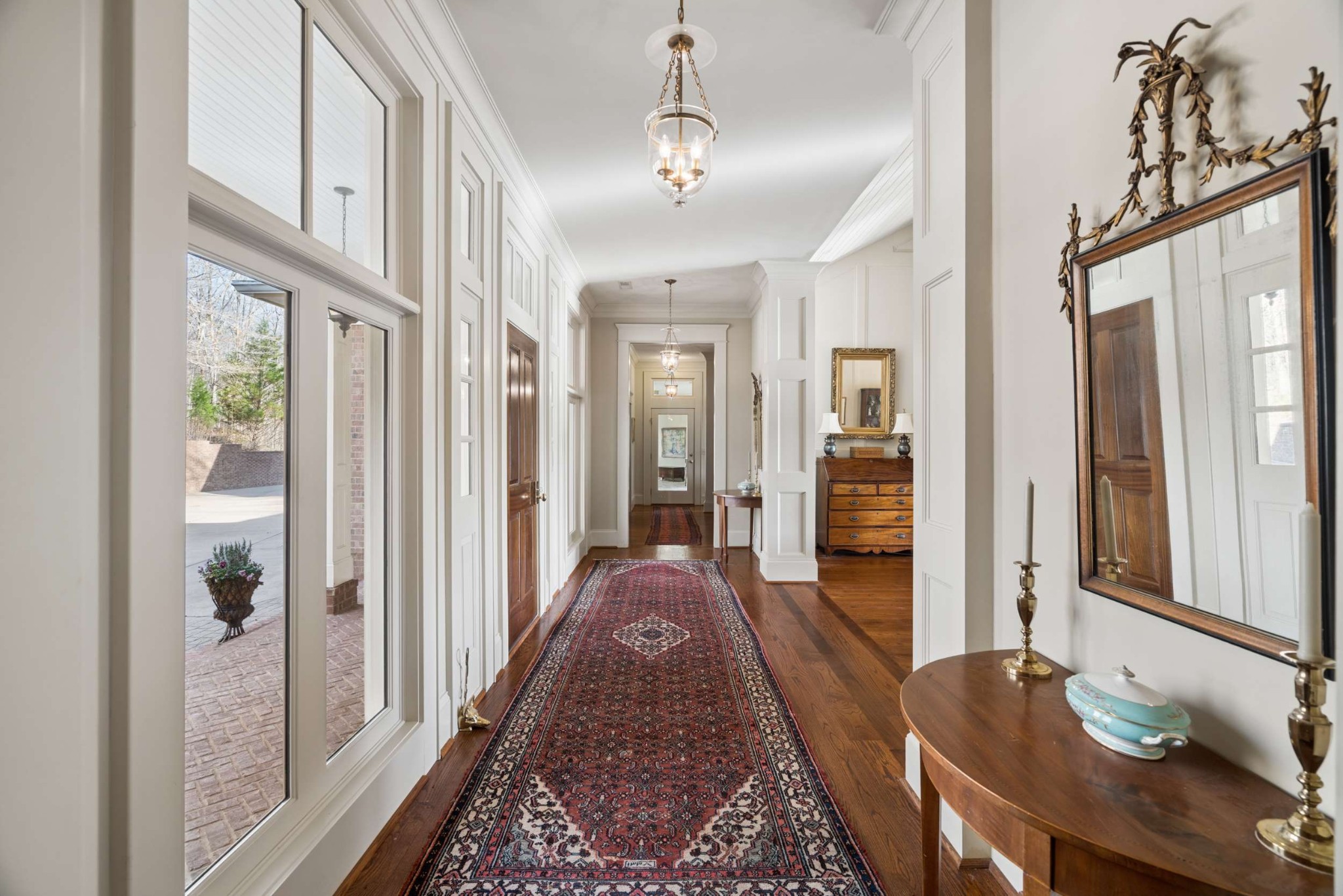 683 Johnson Branch Road Williamsport, TN 38487 - Photo 11 of 62 a hallway with a large mirror and a dining table