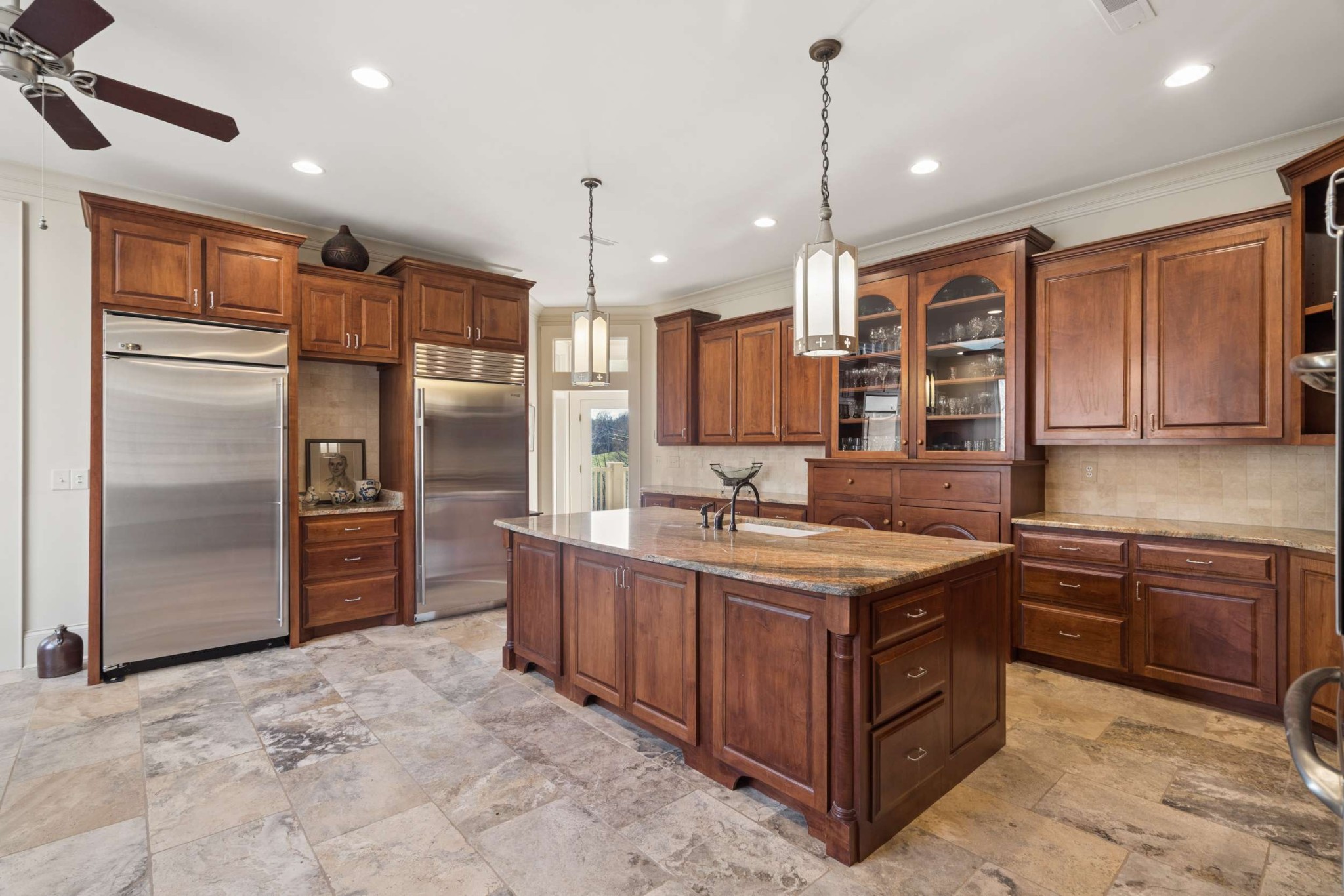 683 Johnson Branch Road Williamsport, TN 38487 - Photo 17 of 62 a kitchen with a refrigerator a sink and wooden cabinets