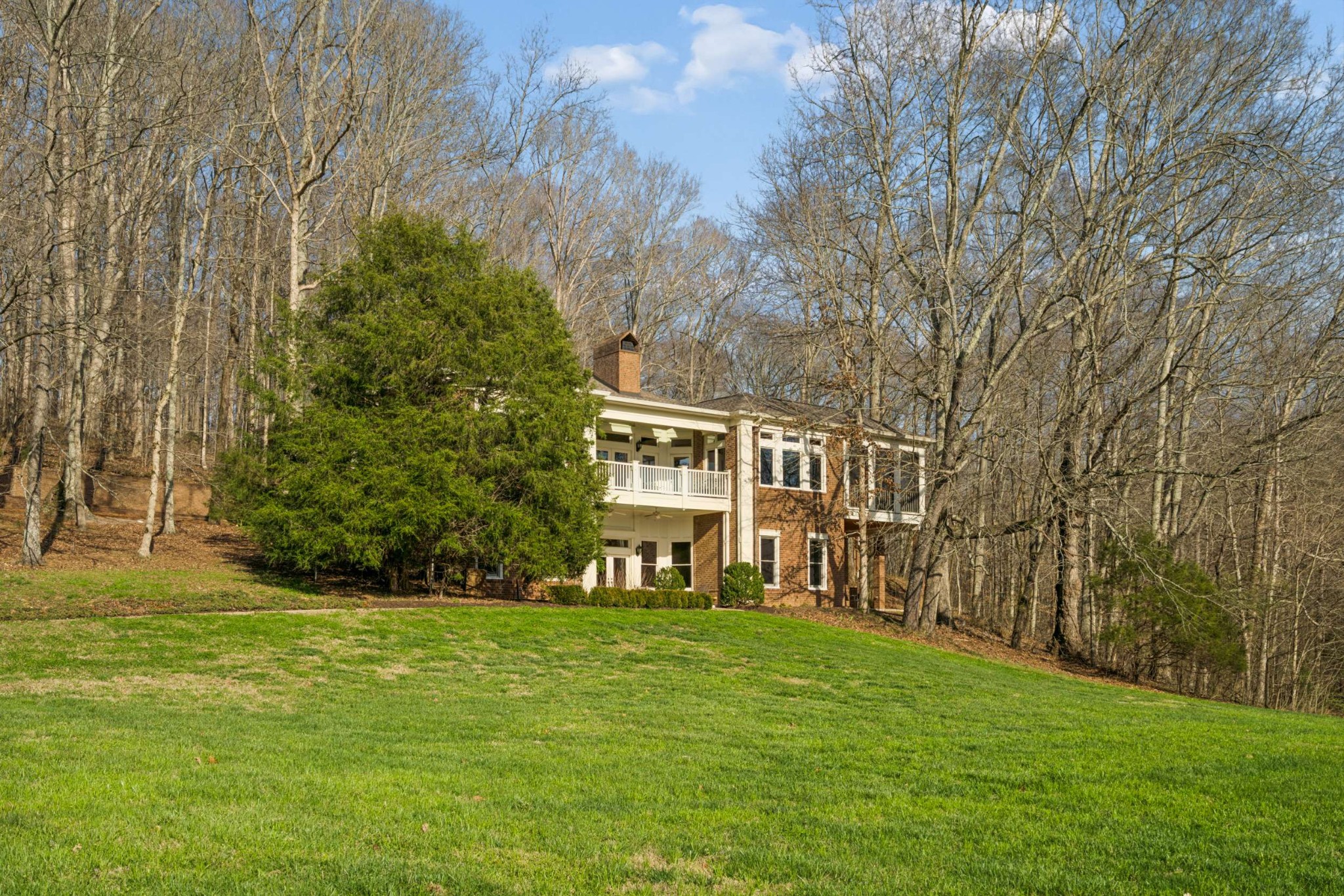 683 Johnson Branch Road Williamsport, TN 38487 - Photo 3 of 62 a view of an house with backyard space and trees